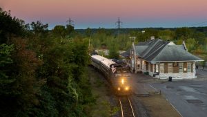 train towards Montreal picking up passengers at Shawinigan station around sunset - David McCormack Photograph