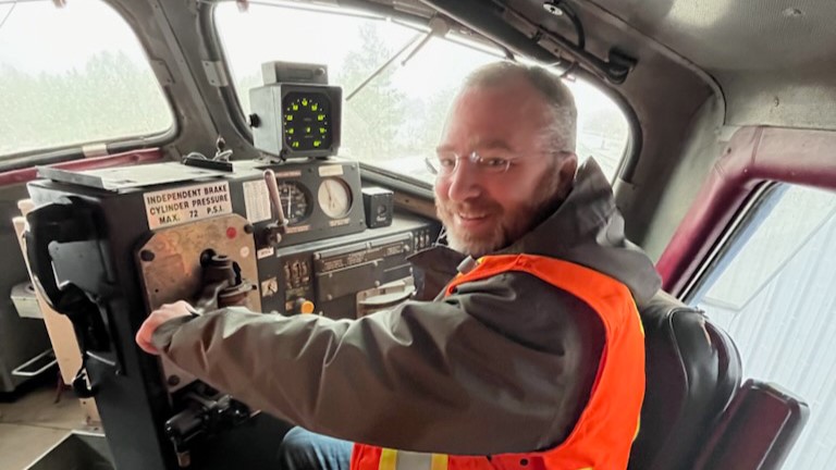 Christopher Greenlaw at the controls of former FP9A locomotive VIA Rail 6539