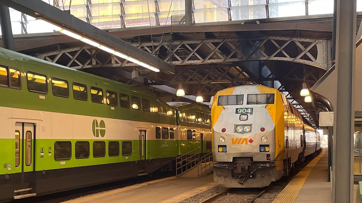 VIA Rail P42 locomotive 904 arriving at Toronto Union Station, with a GO train alongside